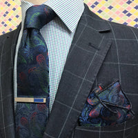 gingham check mens shirt underneath a navy sports jacket with a window pane check