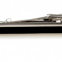 a silver tie clip with a chain and a black centre part 