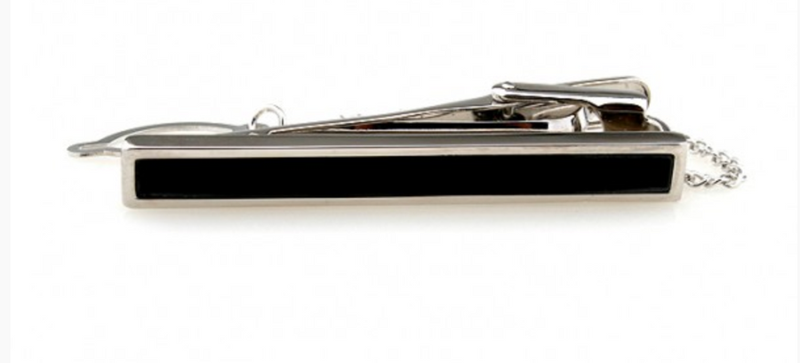 a silver tie clip with a chain and a black centre part 