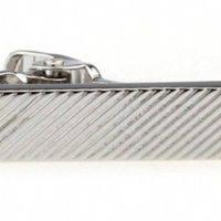 a rectangle shaped tie clip in silver with diagonal stripes on it 