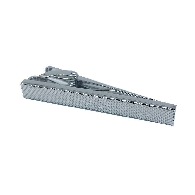 silver tie clip with a diagonal imprint over it